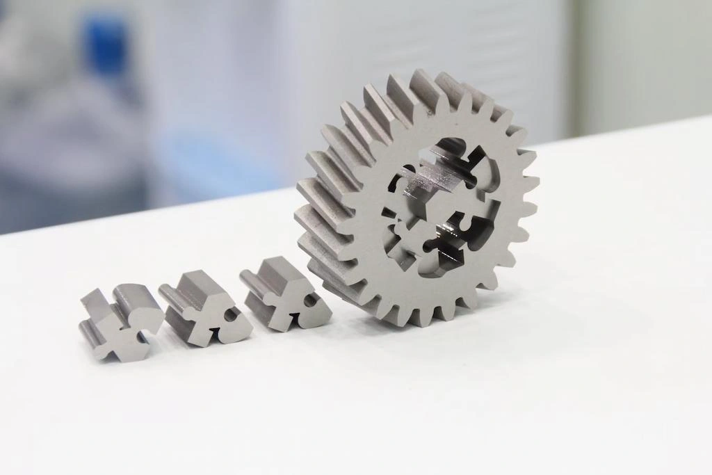 A close-up view of four automotive components made with EDM-wire cutting
