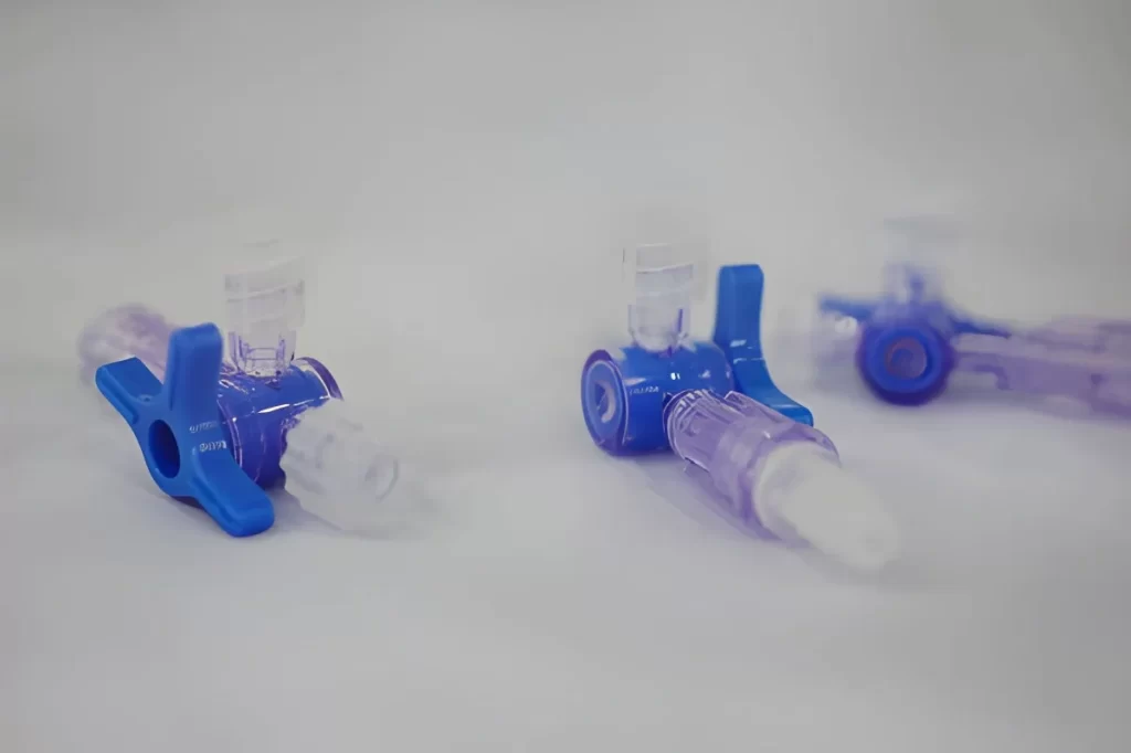 Three ABS interior drip components displayed on a table
