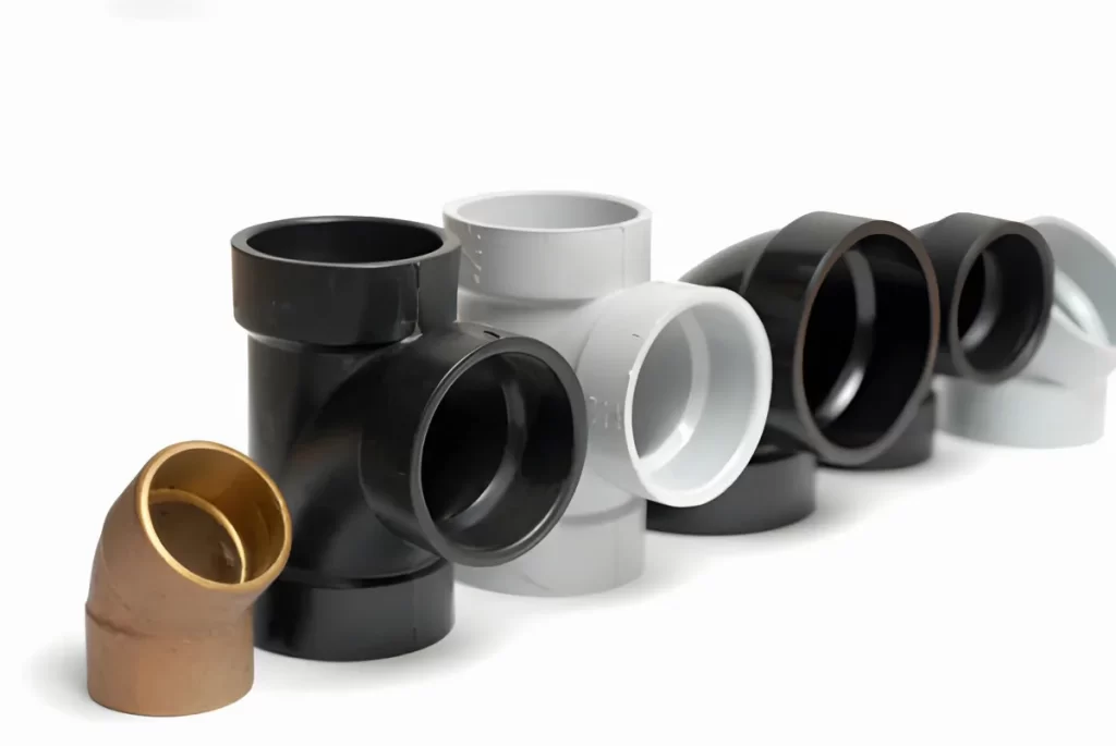 Set of ABS plastic pipe connectors for plumbing use.