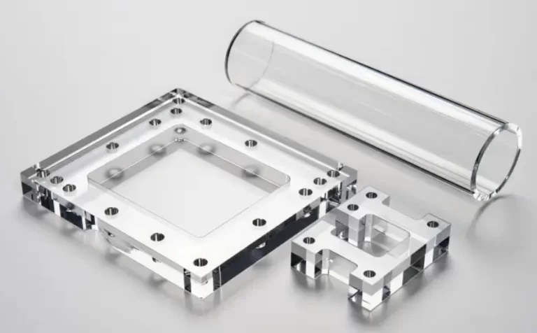 Machined acrylic parts showing optical clarity after polishing