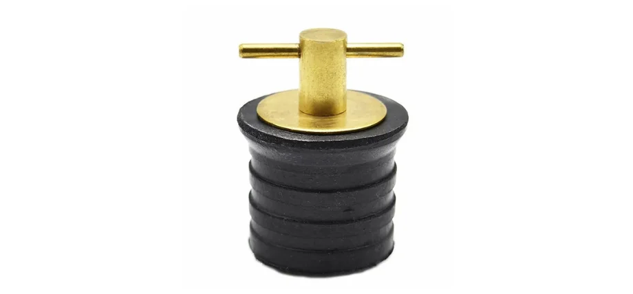 Brass types drain plug featuring a polished yellow brass T-handle and top plate mounted on a black ribbed rubber body, used for sealing applications.