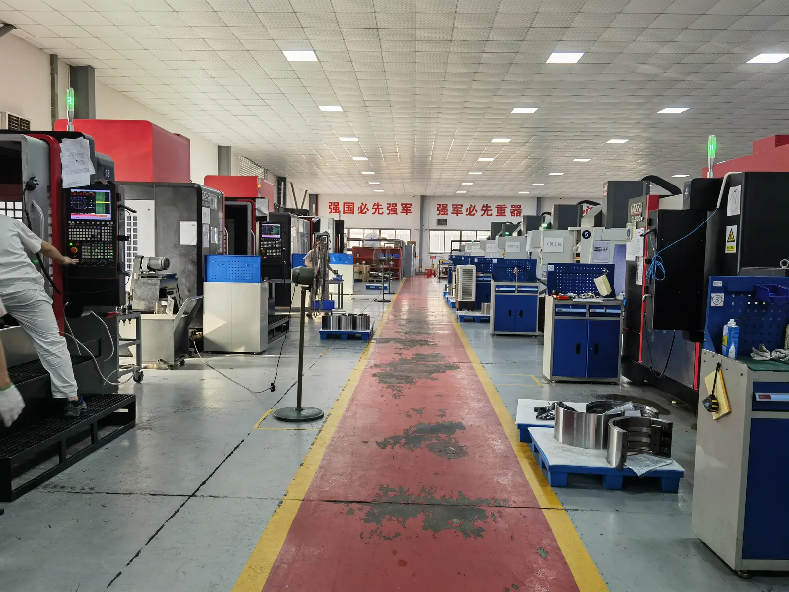 Aisle between rows of CNC machining centres on the Prolean workshop floor