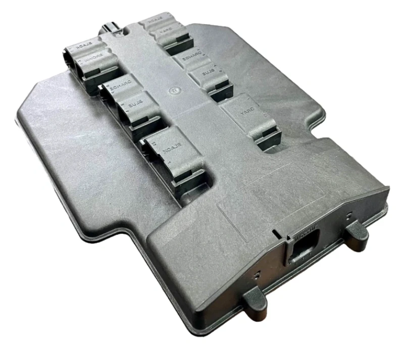 Gray injection-molded automotive electronic control unit housing with multiple wiring harness connector ports