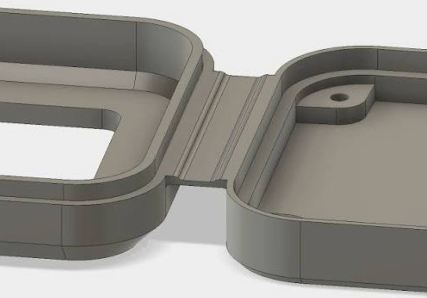 3D CAD model of an injection-molded plastic enclosure featuring a thin-walled living hinge design