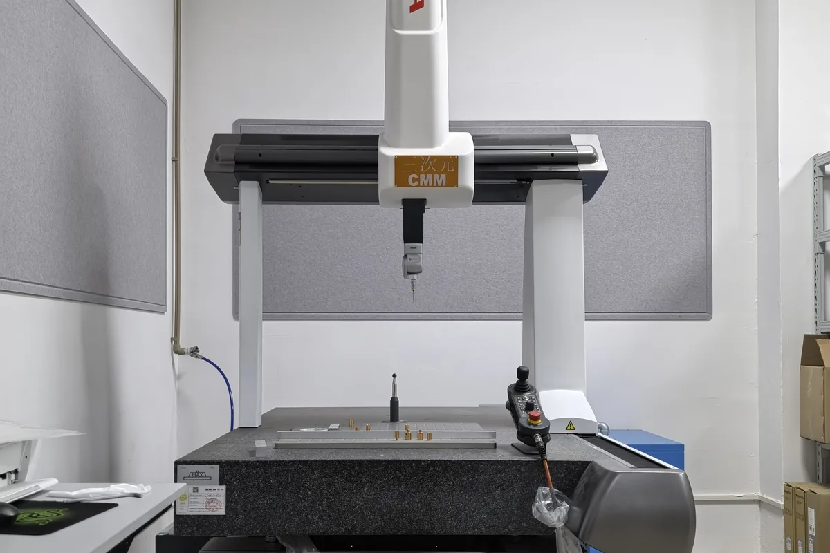 Coordinate measuring machine in the Prolean quality room, granite table and probe head