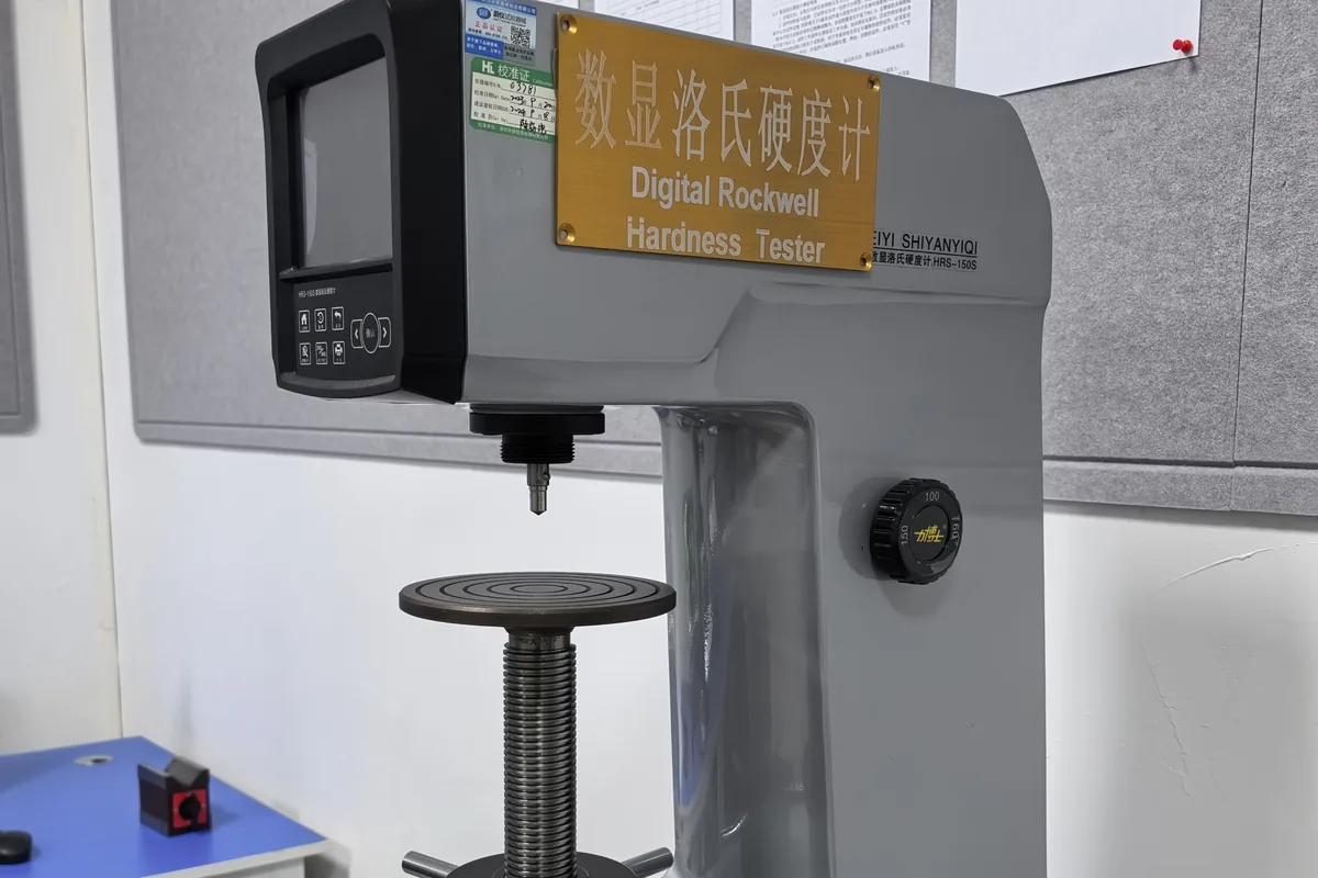 Digital Rockwell hardness tester verifying heat treatment condition