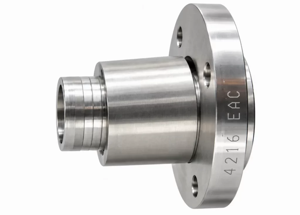 CNC turned metal component with engraved identification text on the flange
