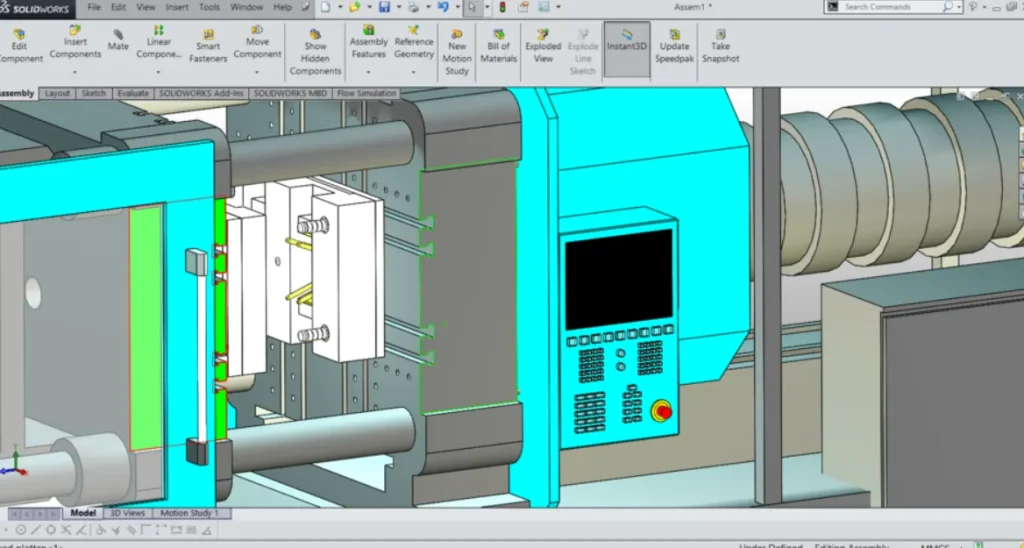 SOLIDWORKS CAD assembly of an industrial injection molding machine showing a mounted mold between turquoise-colored platens with the control panel visible