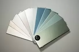 A Wide Range of Powder Coating Finish Options An array of powder-coated metal samples spread out, showing the different color variety.