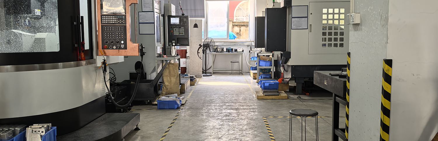 Aisle of CNC machining centres inside the Proleantech workshop in Baoan District, Shenzhen