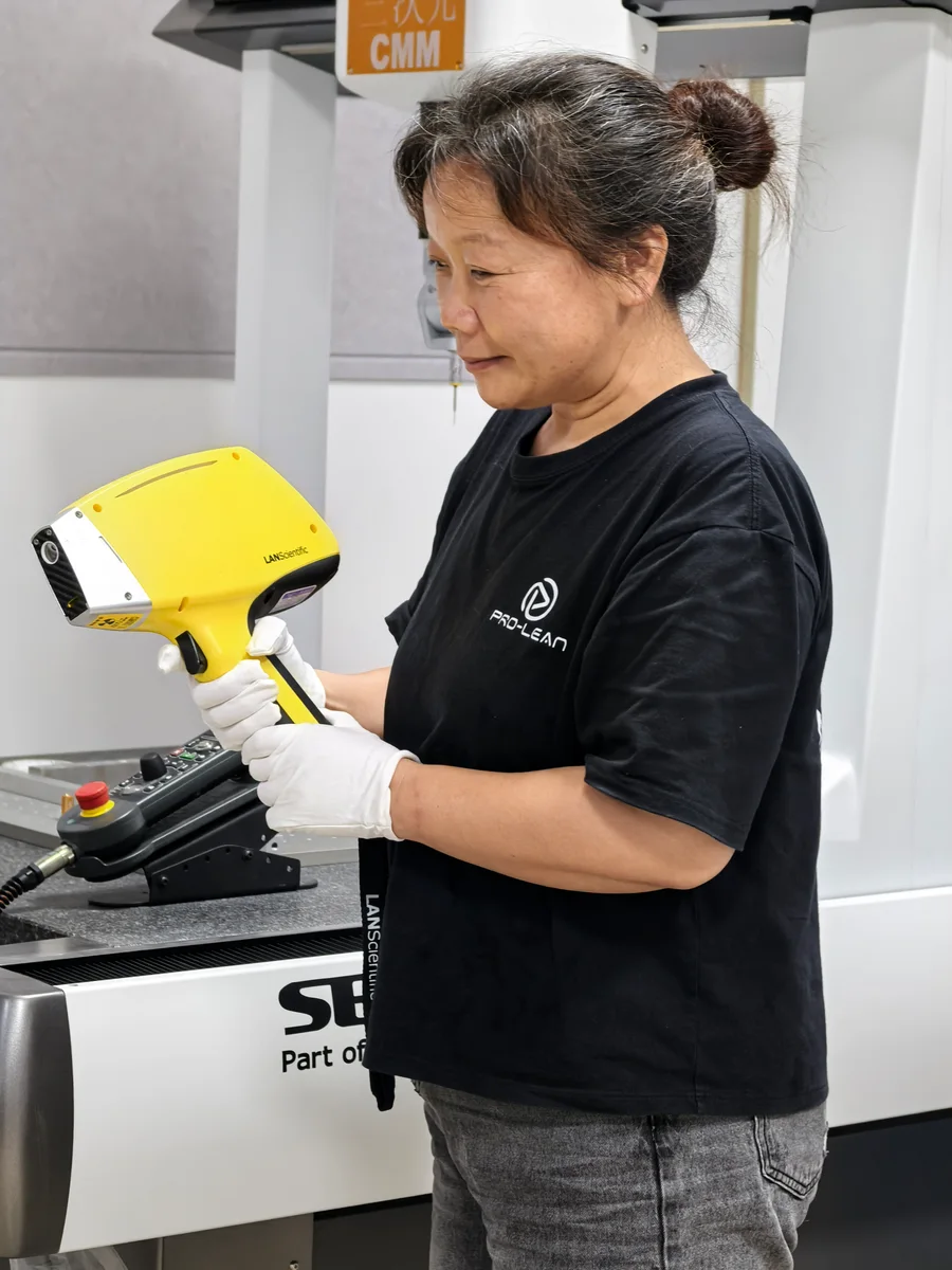 Technician inspecting a finished machined part