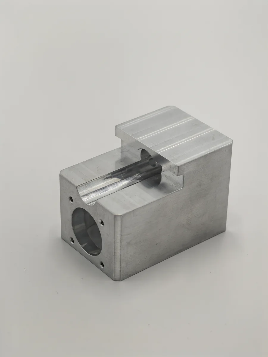 Machined aluminium housing with bores and mounting faces