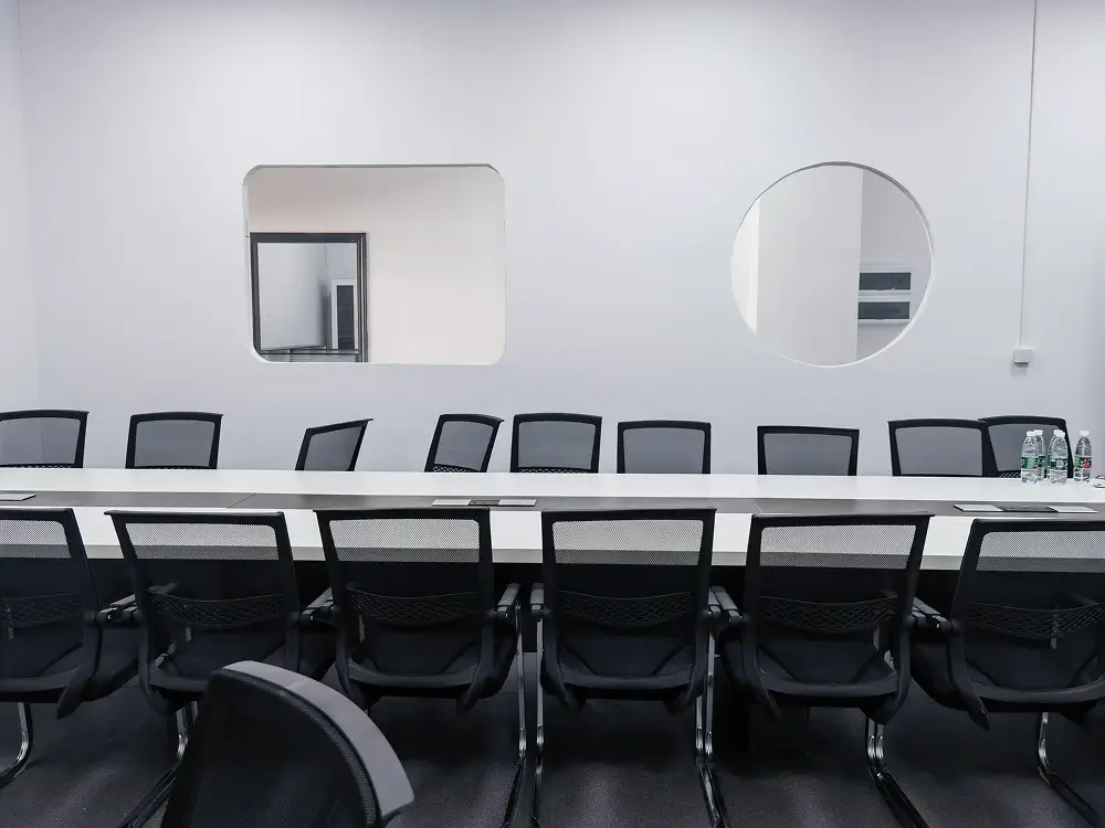 Meeting room with a long table and chairs