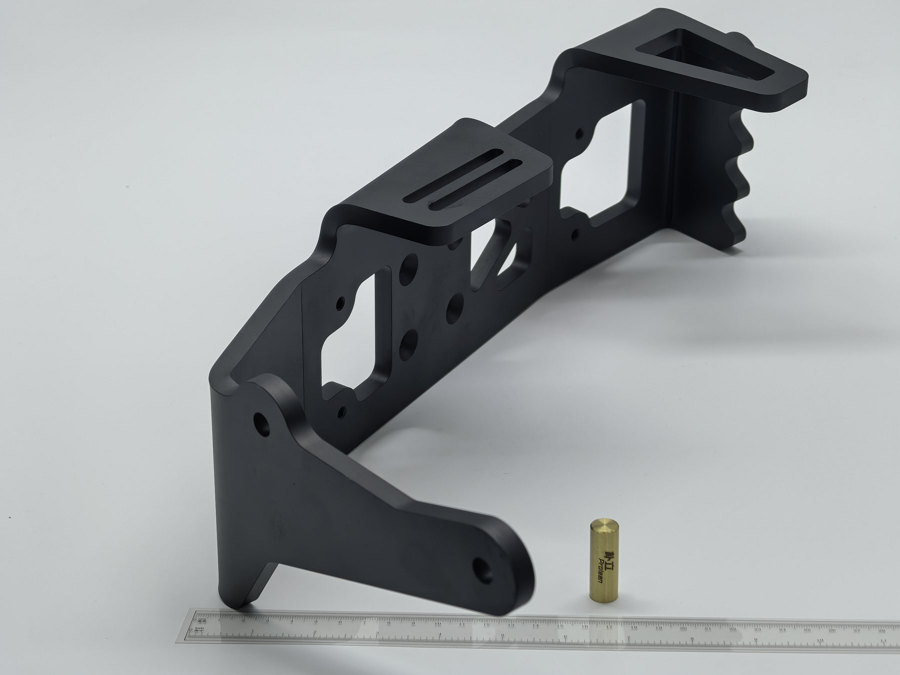 Black finished multi-bend sheet metal bracket with slots and mounting holes