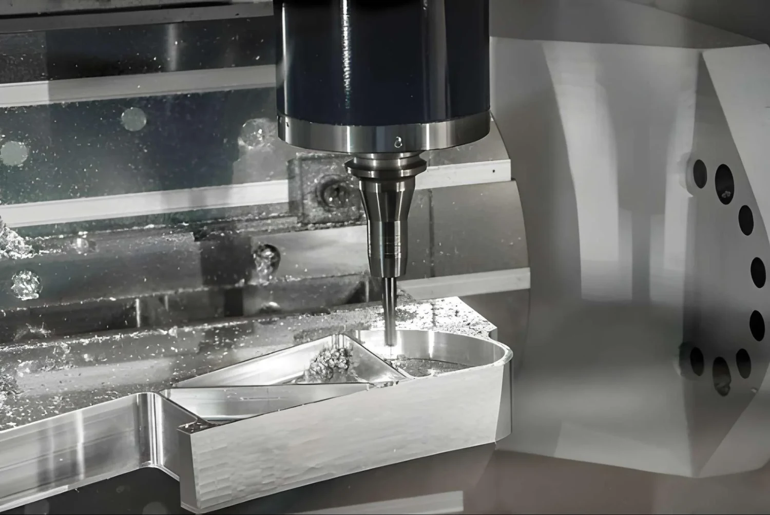 Rotating milling tool machining a clamped metal component