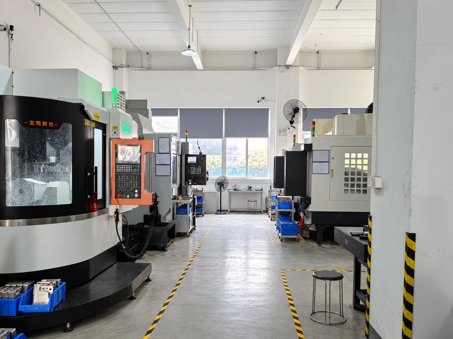 ProleanTech CNC workshop with machining centres along a marked production aisle