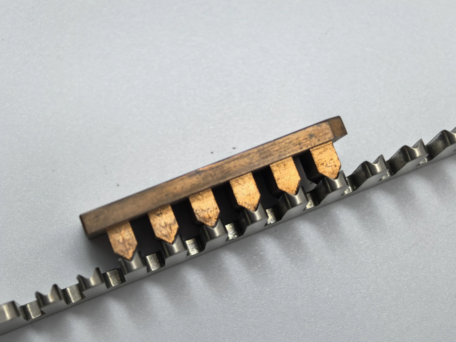 Angled view of the shaped copper electrode and corresponding slots