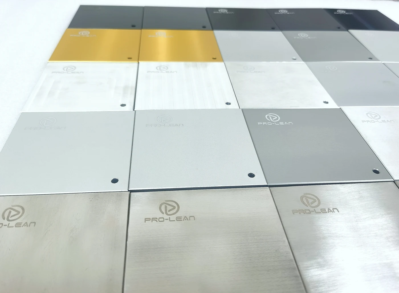 Prolean surface finish sample plates showing different colours and textures