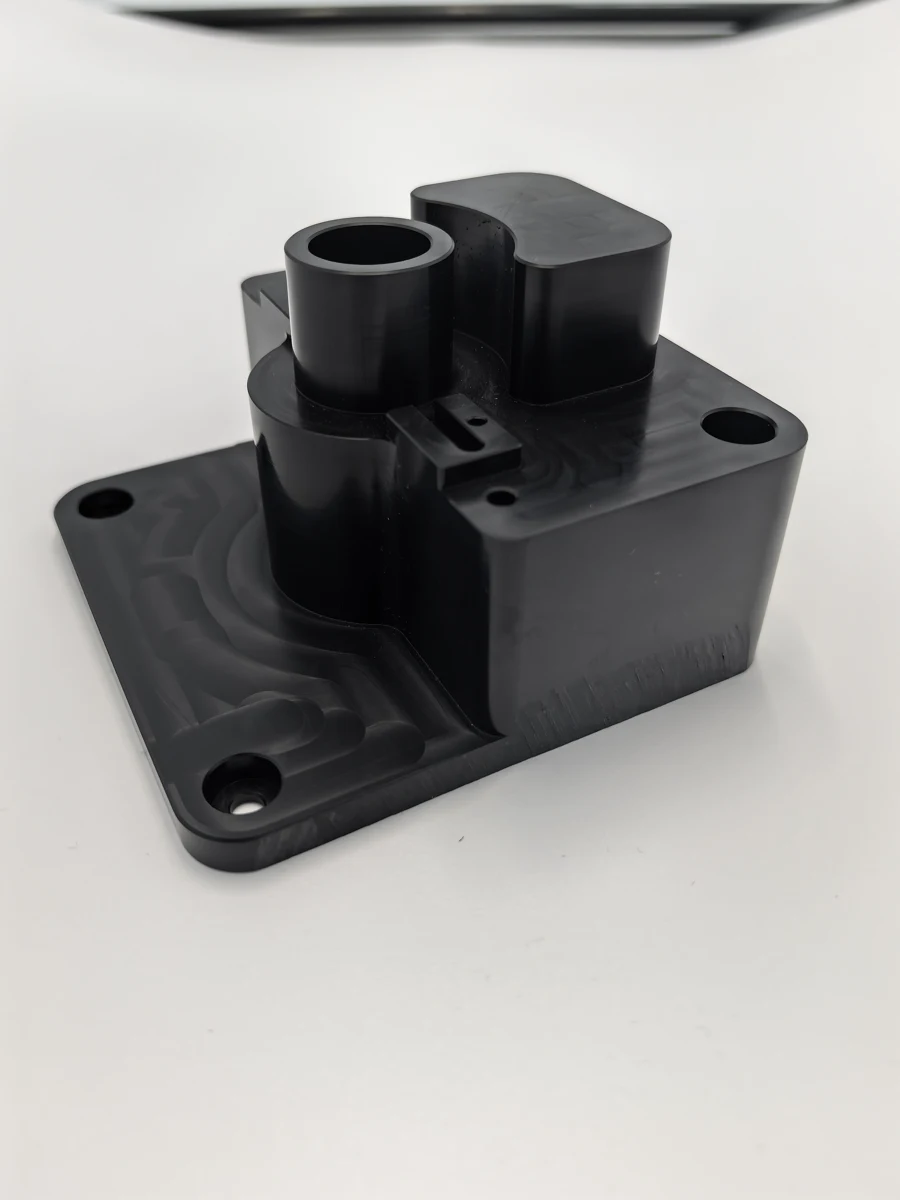 Manufactured component with cylindrical features and mounting holes