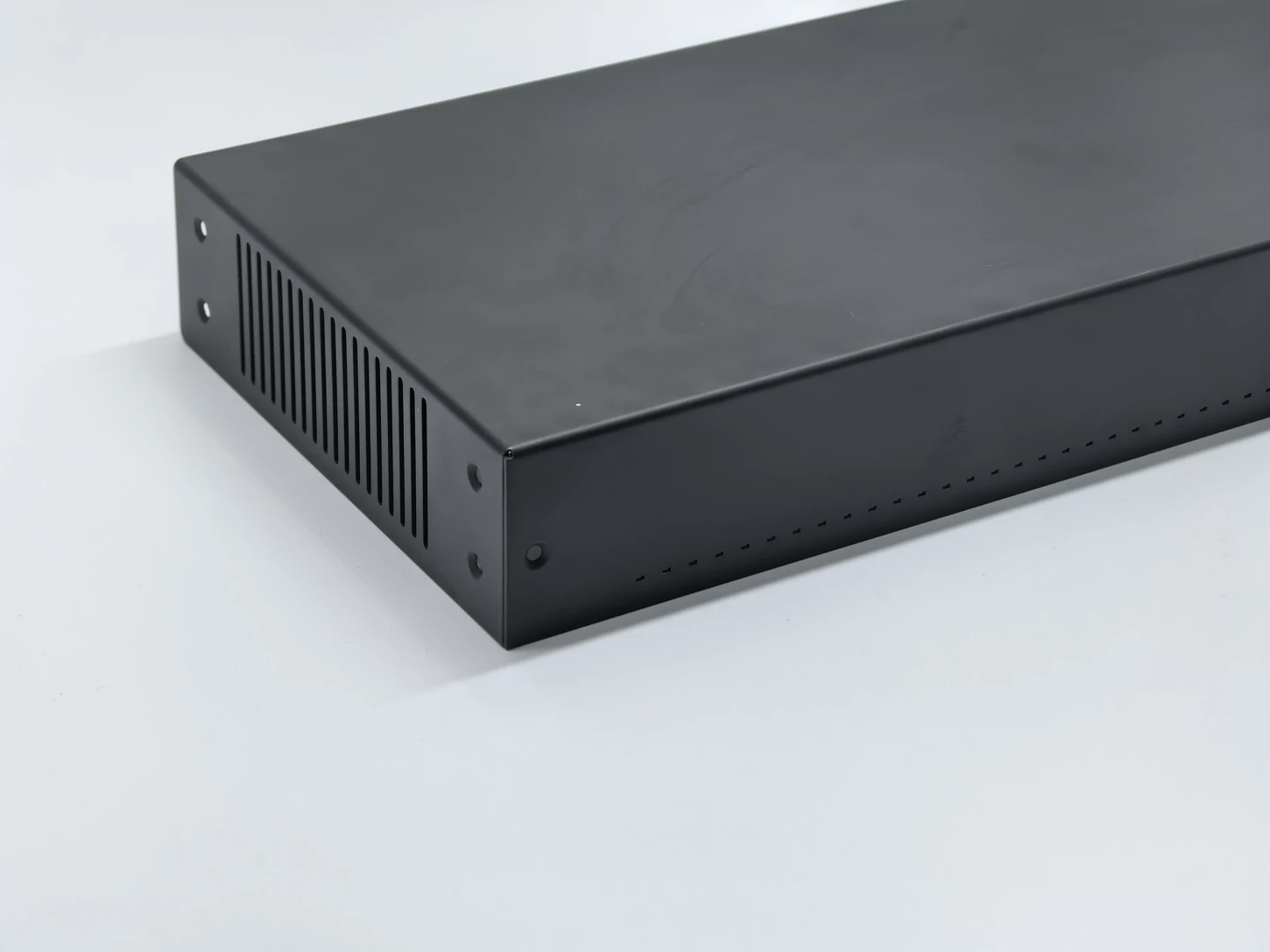 Black equipment enclosure with vented sides