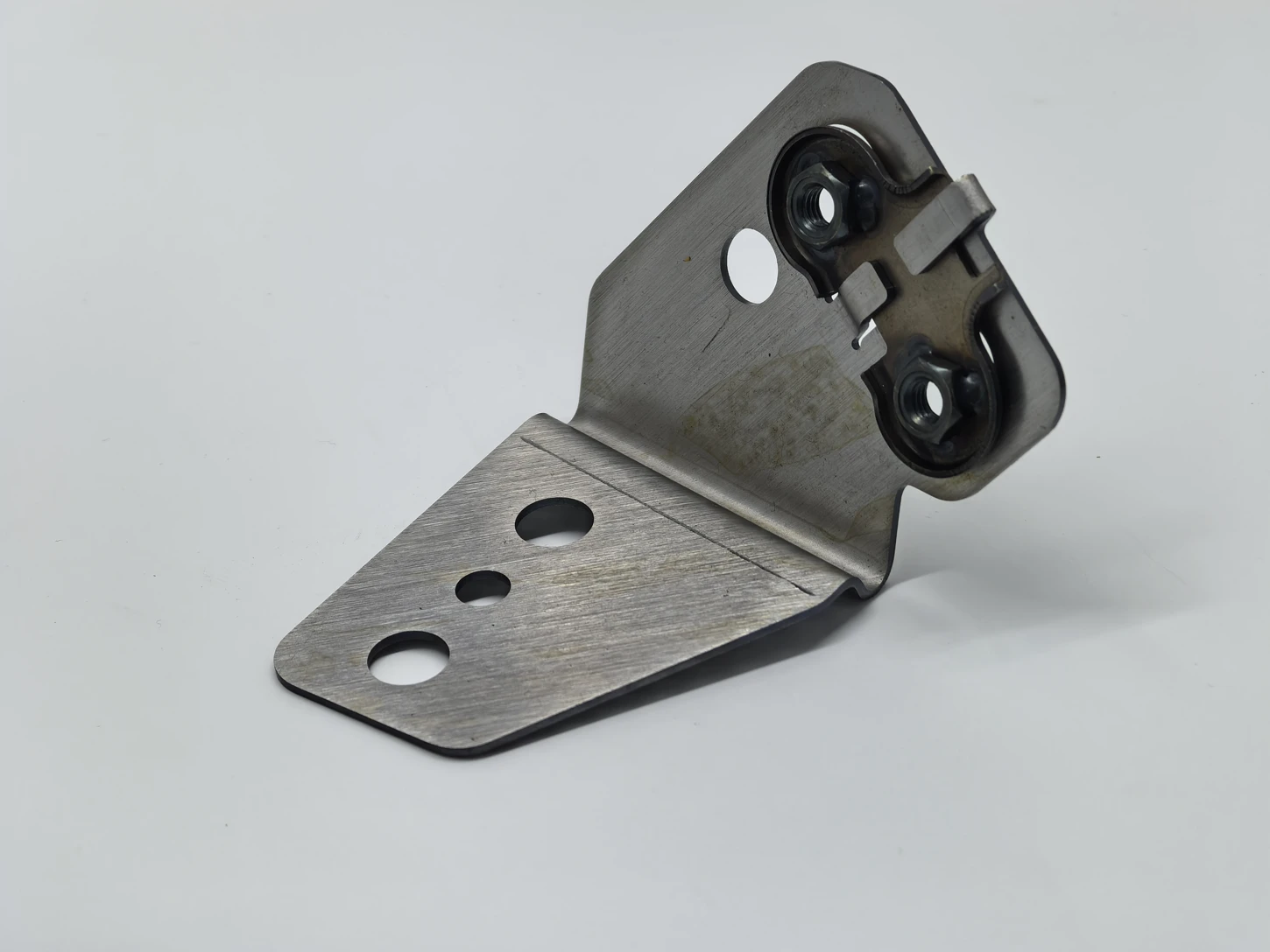 Formed bracket with mounting holes and fitted components