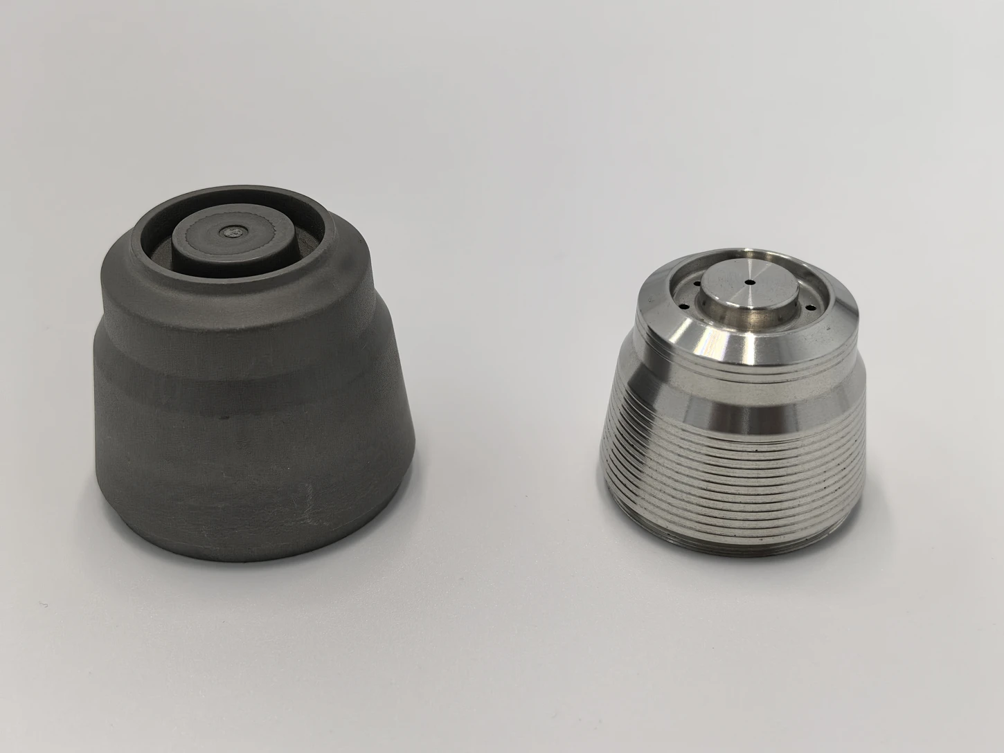 Metal injection molding: semi-finished component on the left and finished component after heating on the right