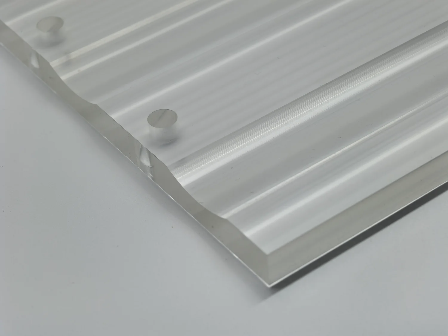 Manufactured profile with channels and drilled features