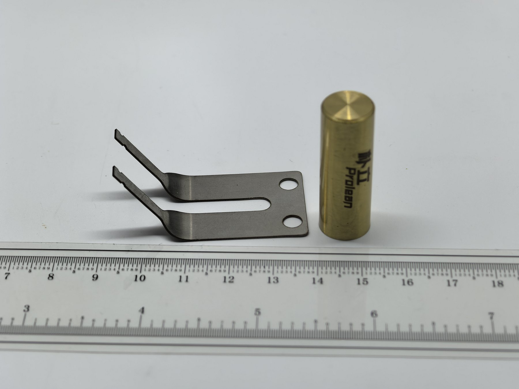 Formed stainless steel spring clip with two mounting holes