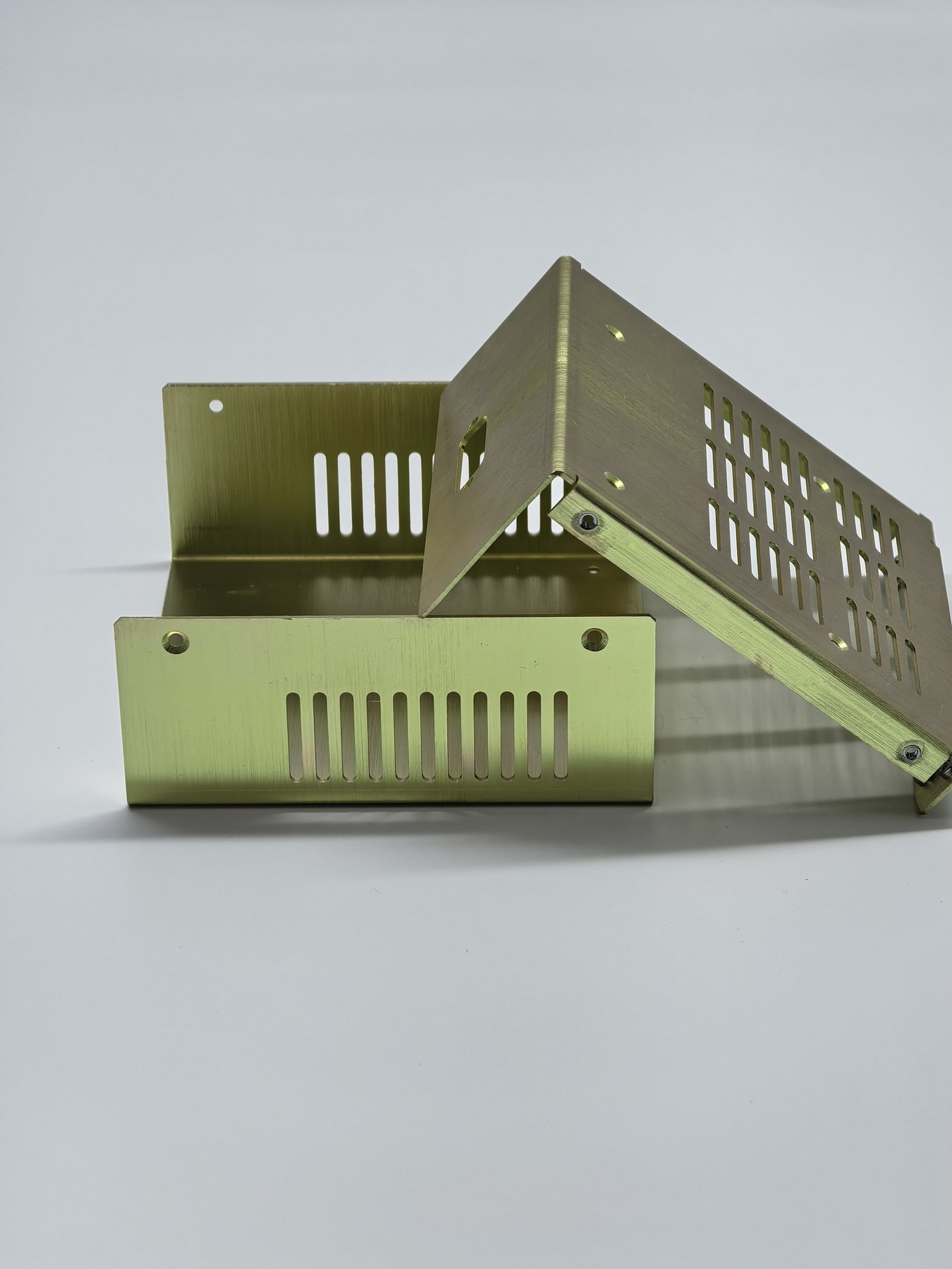 Vented formed sheet metal enclosure with a yellow chromate finish